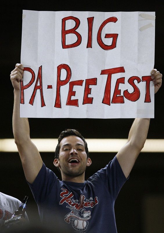 A Yankee fan holds up a sign about David Ortiz during the 2009 season.