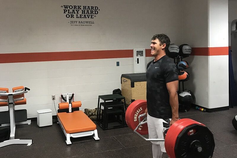 Brooks koepka in the gym with dumb-bell