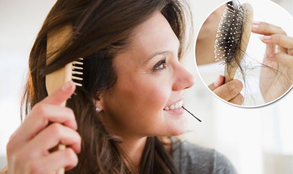 A woman combs her hair